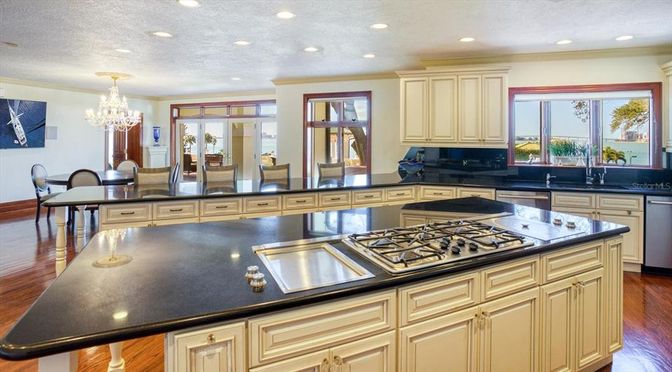 Chandelier, Dining room, Interior, Kitchen, Recessed Lighting, Stainless Steel Appliances, Wood Texture Flooring