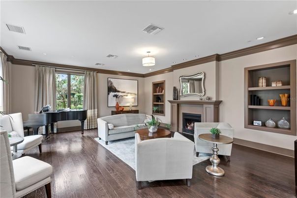 Fireplace, Interior, Living room, Piano, Recessed Lighting, Wood Texture Flooring