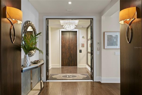 Chandelier, Elevator, Interior, Recessed Lighting, Wood Texture Flooring