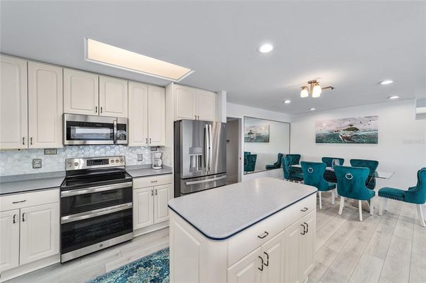 Dining room, Interior, Kitchen, Recessed Lighting, Stainless Steel Appliances, Wood Texture Flooring