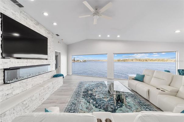 Fireplace, Interior, Living room, Recessed Lighting, Water, Wood Texture Flooring