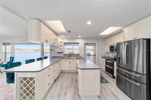 Interior, Kitchen, Recessed Lighting, Stainless Steel Appliances, Water, Wood Texture Flooring