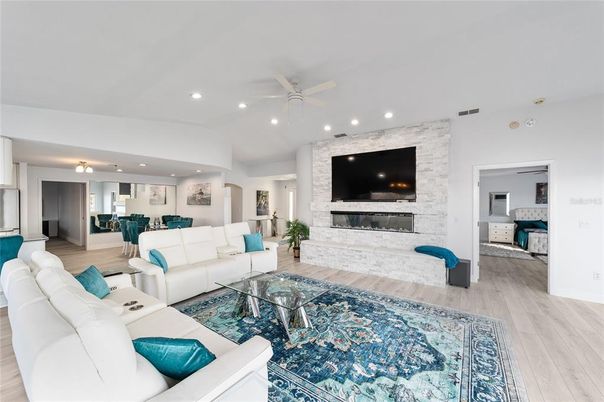 Fireplace, Interior, Living room, Recessed Lighting, Stone Walls, Wood Texture Flooring