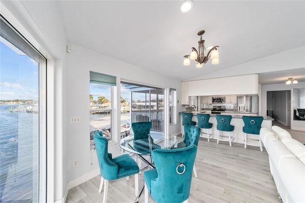 Chandelier, Dining room, Interior, Kitchen, Recessed Lighting, Stainless Steel Appliances, Wood Texture Flooring