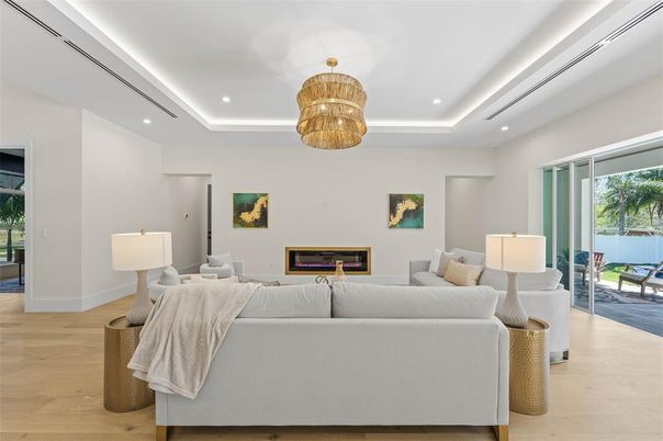 Chandelier, Fireplace, Interior, Living room, Recessed Lighting, Wood Texture Flooring