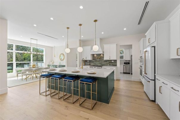Dining room, Interior, Kitchen, Pendant Lights, Recessed Lighting, Stainless Steel Appliances, Wood Texture Flooring