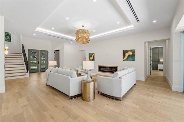 Chandelier, Fireplace, Interior, Living room, Pendant Lights, Recessed Lighting, Wood Texture Flooring