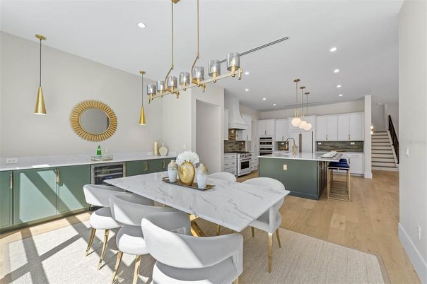 Dining room, Interior, Kitchen, Pendant Lights, Recessed Lighting, Stainless Steel Appliances, Wood Texture Flooring
