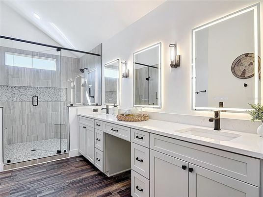 Bathroom, Dual Sink Vanities, Glass Shower, Interior, Recessed Lighting, Wood Texture Flooring