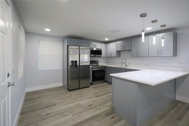 Interior, Kitchen, Pendant Lights, Recessed Lighting, Stainless Steel Appliances, Wood Texture Flooring
