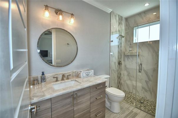 Bathroom, Glass Shower, Interior, Marble Walls, Recessed Lighting, Wood Texture Flooring