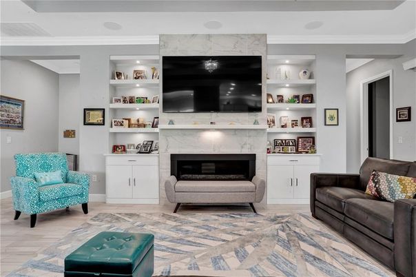Fireplace, Interior, Living room, Marble Walls, Recessed Lighting, Wood Texture Flooring