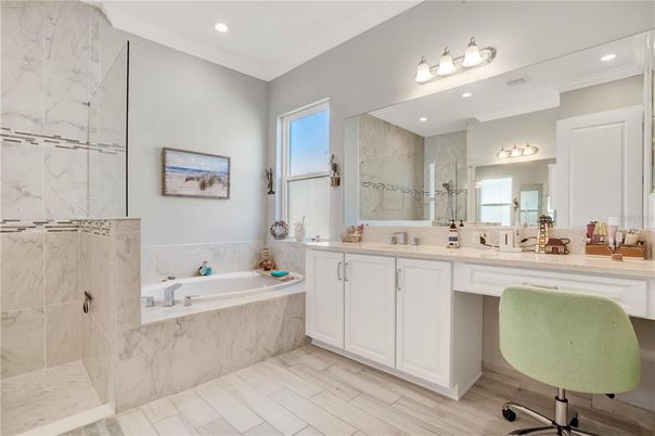 Bathroom, Dual Sink Vanities, Interior, Marble Walls, Recessed Lighting, Wood Texture Flooring