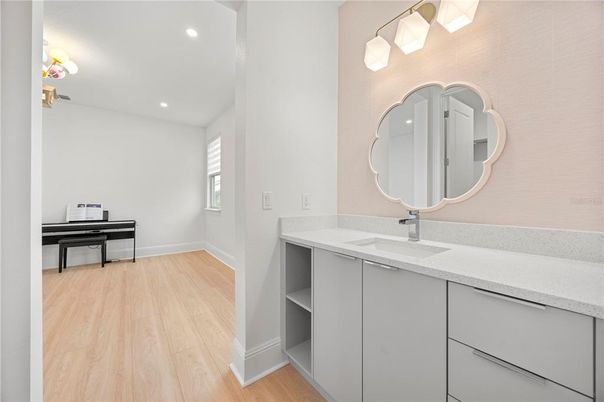 Bathroom, Dual Sink Vanities, Interior, Piano, Recessed Lighting, Wood Texture Flooring