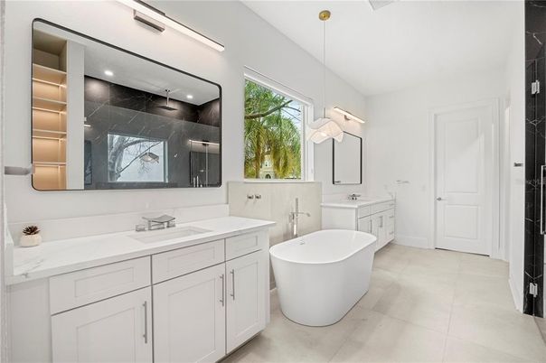Bathroom, Dual Sink Vanities, Free Standing Baths, Interior, Marble Walls, Pendant Lights, Recessed Lighting