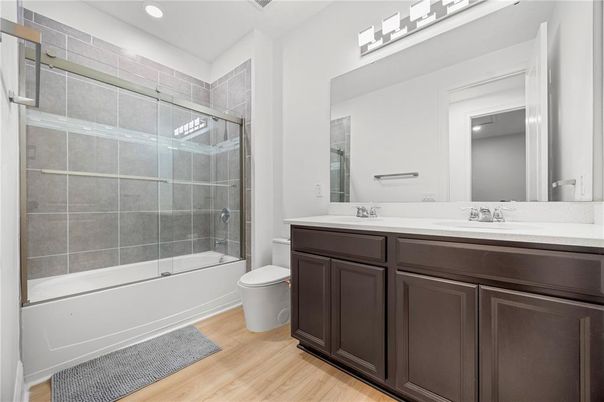 Bathroom, Dual Sink Vanities, Glass Shower, Interior, Recessed Lighting, Wood Texture Flooring