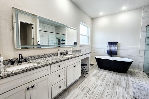 Bathroom, Dual Sink Vanities, Free Standing Baths, Interior, Recessed Lighting, Wood Texture Flooring