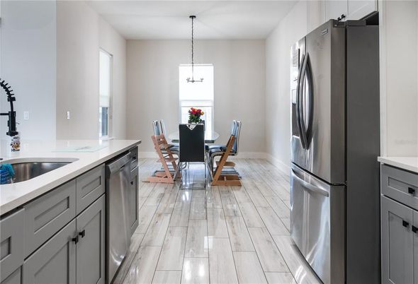 Dining room, Interior, Kitchen, Pendant Lights, Stainless Steel Appliances, Wood Texture Flooring