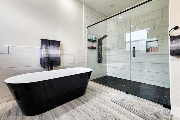 Bathroom, Free Standing Baths, Glass Shower, Interior, Recessed Lighting, Wood Texture Flooring