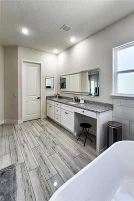 Bathroom, Dual Sink Vanities, Free Standing Baths, Interior, Recessed Lighting, Wood Texture Flooring