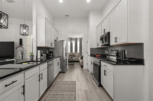Interior, Kitchen, Pendant Lights, Recessed Lighting, Stainless Steel Appliances, Wood Texture Flooring