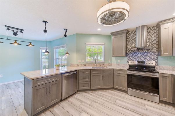 Interior, Kitchen, Pendant Lights, Recessed Lighting, Stainless Steel Appliances, Wood Texture Flooring