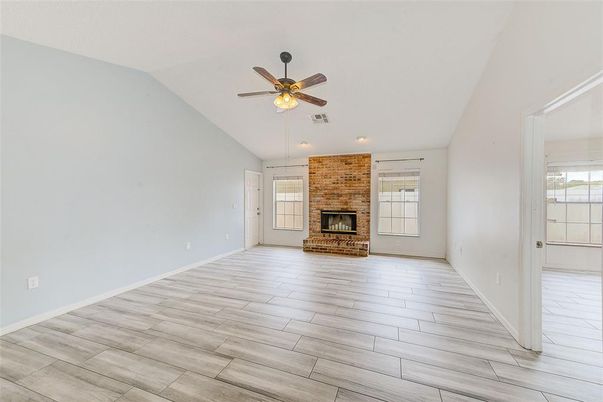 Empty room, Fireplace, Interior, Recessed Lighting, Stone Walls, Wood Texture Flooring