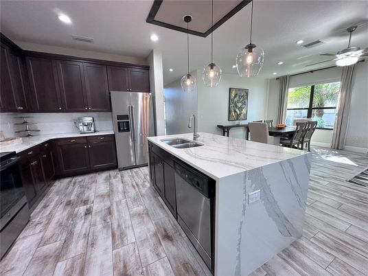Dining room, Interior, Kitchen, Pendant Lights, Recessed Lighting, Stainless Steel Appliances, Wood Texture Flooring