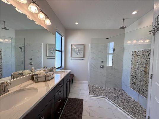 Bathroom, Dual Sink Vanities, Glass Shower, Interior, Marble, Marble Walls, Recessed Lighting
