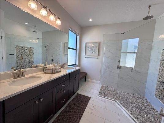 Bathroom, Dual Sink Vanities, Glass Shower, Interior, Marble, Marble Walls, Recessed Lighting