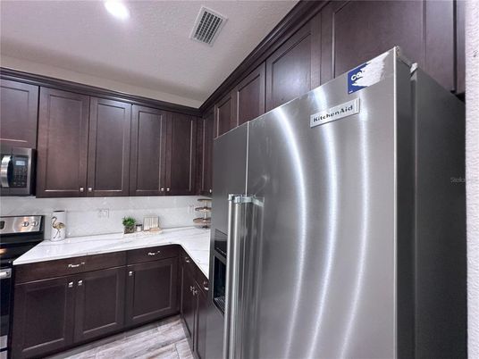 Interior, Kitchen, Recessed Lighting, Stainless Steel Appliances, Wood Texture Flooring