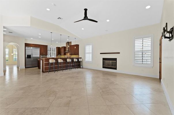 Empty room, Fireplace, Interior, Kitchen, Pendant Lights, Recessed Lighting, Stainless Steel Appliances