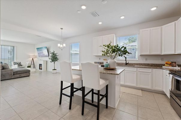Chandelier, Dining room, Fireplace, Interior, Kitchen, Living room, Pendant Lights, Recessed Lighting, Stainless Steel Appliances