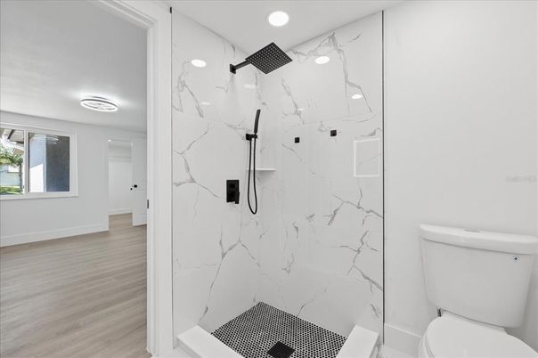 Bathroom, Glass Shower, Interior, Marble Walls, Recessed Lighting, Wood Texture Flooring