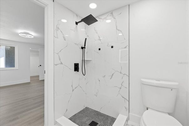 Bathroom, Glass Shower, Interior, Marble Walls, Recessed Lighting, Wood Texture Flooring