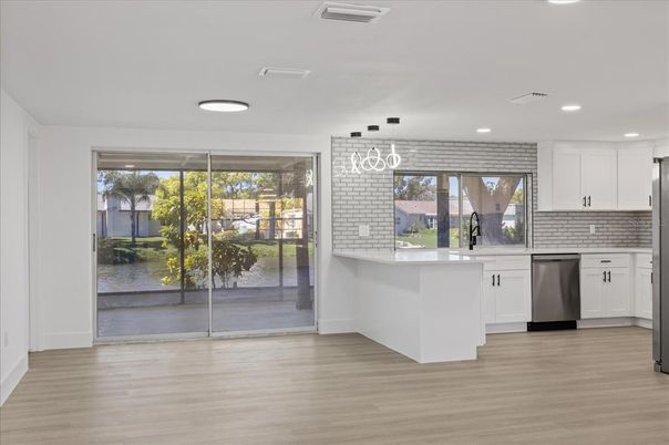 Interior, Kitchen, Pendant Lights, Recessed Lighting, Stainless Steel Appliances, Wood Texture Flooring