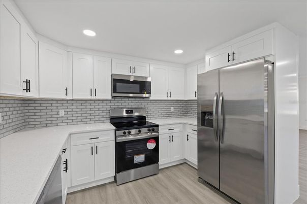 Interior, Kitchen, Recessed Lighting, Stainless Steel Appliances, Wood Texture Flooring