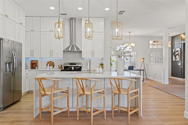 Dining room, Interior, Kitchen, Pendant Lights, Recessed Lighting, Stainless Steel Appliances, Wood Texture Flooring