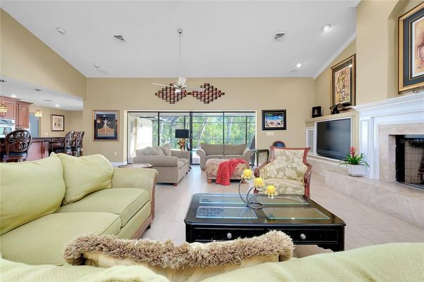 Chandelier, Dining room, Fireplace, Interior, Living room, Pendant Lights, Recessed Lighting, Wood Texture Flooring