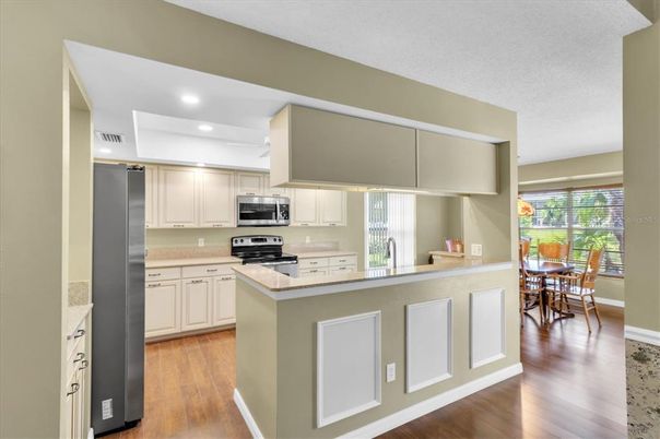 Dining room, Interior, Kitchen, Recessed Lighting, Stainless Steel Appliances, Wood Texture Flooring