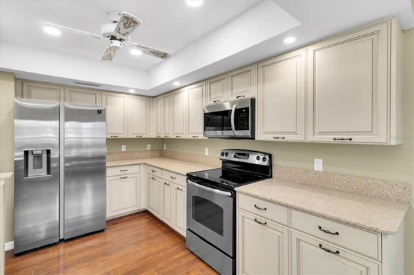 Interior, Kitchen, Recessed Lighting, Stainless Steel Appliances, Wood Texture Flooring