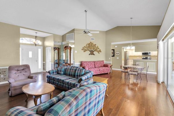 Chandelier, Dining room, Interior, Kitchen, Living room, Pendant Lights, Stainless Steel Appliances, Wood Texture Flooring