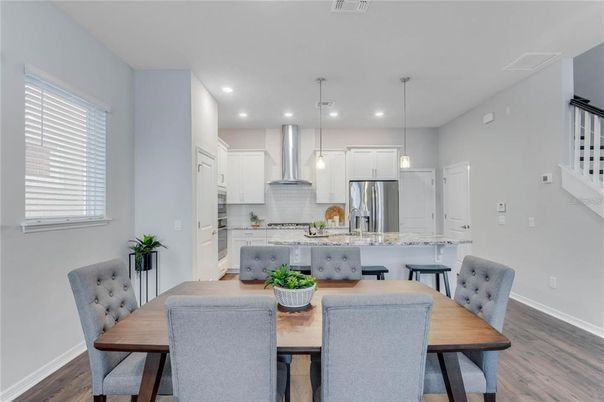 Dining room, Interior, Kitchen, Pendant Lights, Recessed Lighting, Stainless Steel Appliances, Wood Texture Flooring