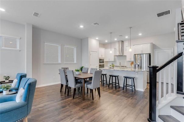 Dining room, Interior, Kitchen, Pendant Lights, Recessed Lighting, Stainless Steel Appliances, Wood Texture Flooring