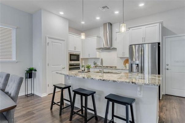 Interior, Kitchen, Pendant Lights, Recessed Lighting, Stainless Steel Appliances, Wood Texture Flooring