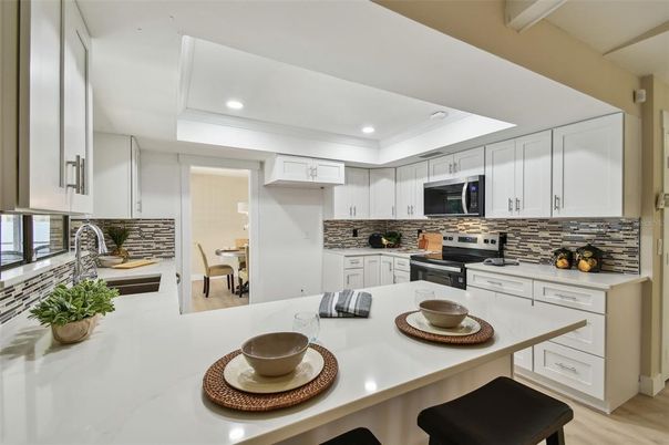 Dining room, Interior, Kitchen, Recessed Lighting, Stainless Steel Appliances, Wood Texture Flooring
