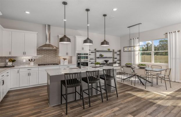 Dining room, Interior, Kitchen, Pendant Lights, Recessed Lighting, Stainless Steel Appliances, Wood Texture Flooring