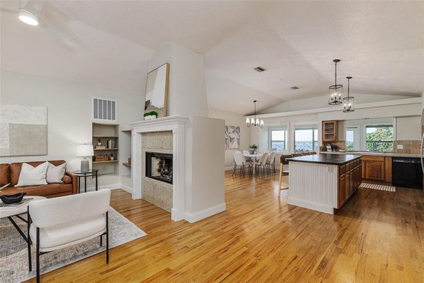 Chandelier, Dining room, Fireplace, Interior, Kitchen, Living room, Pendant Lights, Recessed Lighting, Wood Texture Flooring