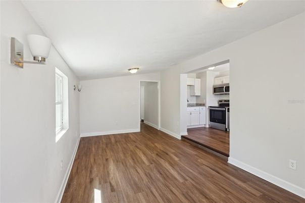 Empty room, Interior, Kitchen, Stainless Steel Appliances, Wood Texture Flooring