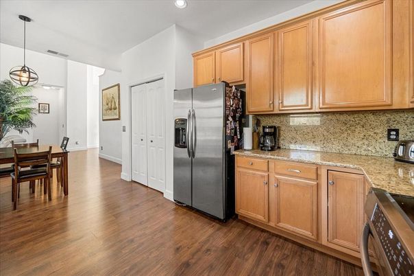 Dining room, Interior, Kitchen, Pendant Lights, Recessed Lighting, Stainless Steel Appliances, Wood Texture Flooring